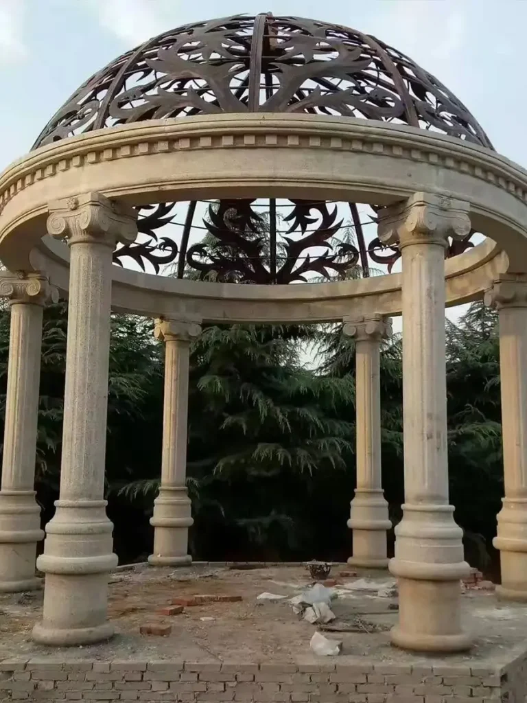 White stone garden pavilion designed with classical marble column proportions.