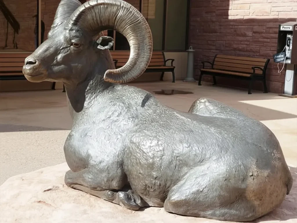 close up horn detail of bighorn sheep bronze statue