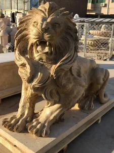 Majestic lion sculpture in yellow marble.
