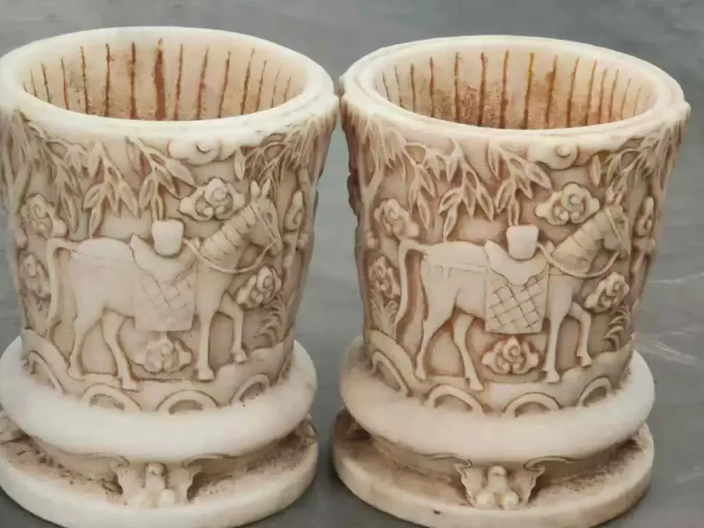 Detailed view of the carvings on stone flower pots, illustrating how natural aging and patina development enhance the authenticity of real stone.