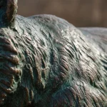 Patina finish on bronze bear sculpture