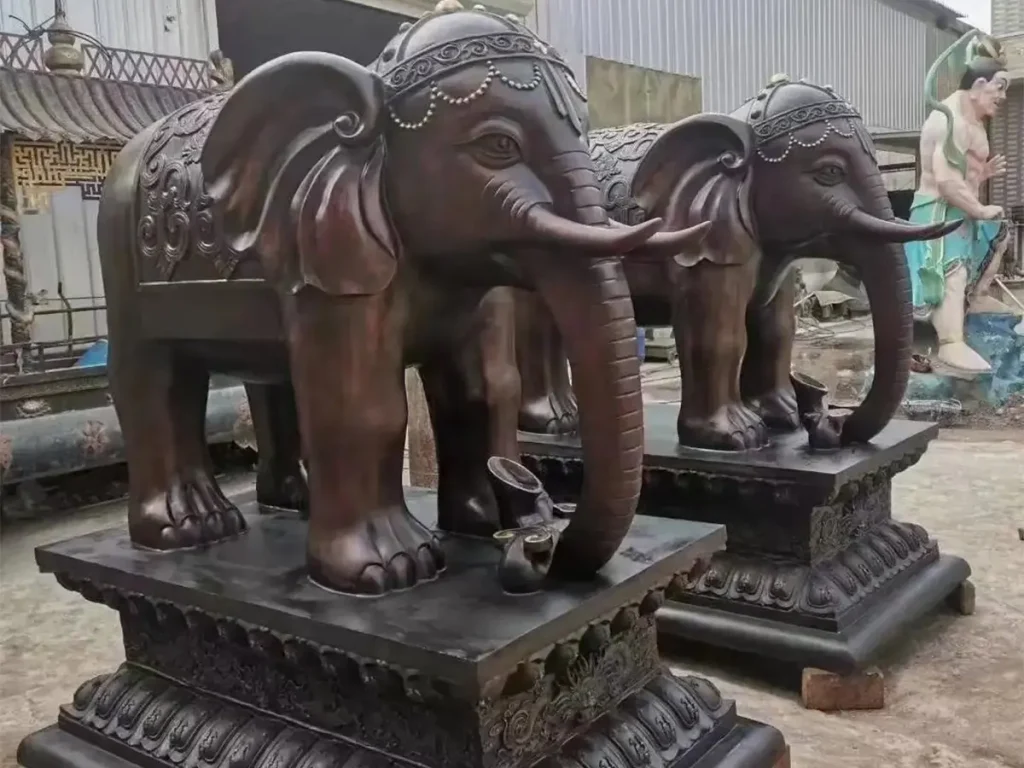 Pair of bronze elephant statues guarding a luxury home entrance