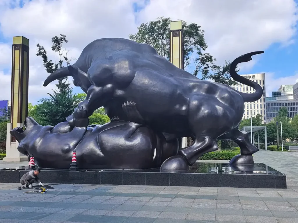 Bull Stepping on Bear sculpture in Guizhou ZTF, China