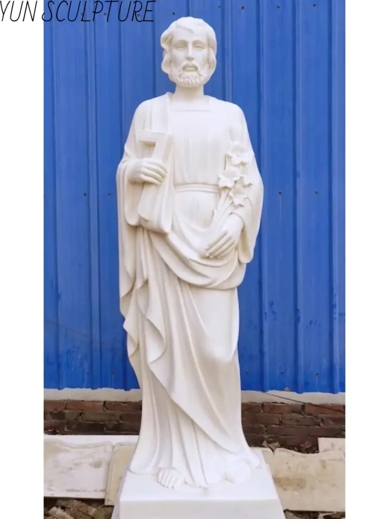 Traditional full-length marble sculpture of Saint Joseph, carved with detailed robes to establish a strong compositional presence.