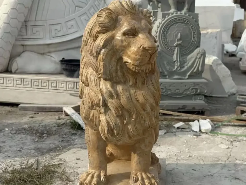 Front view of a classic yellow stone guardian lion statue, highlighting the alert posture and broad chest of a true estate sentinel.