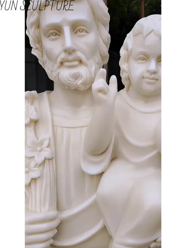 Close-up of a marble Saint Joseph statue, highlighting the fine surface resolution and expert craftsmanship in the facial features.