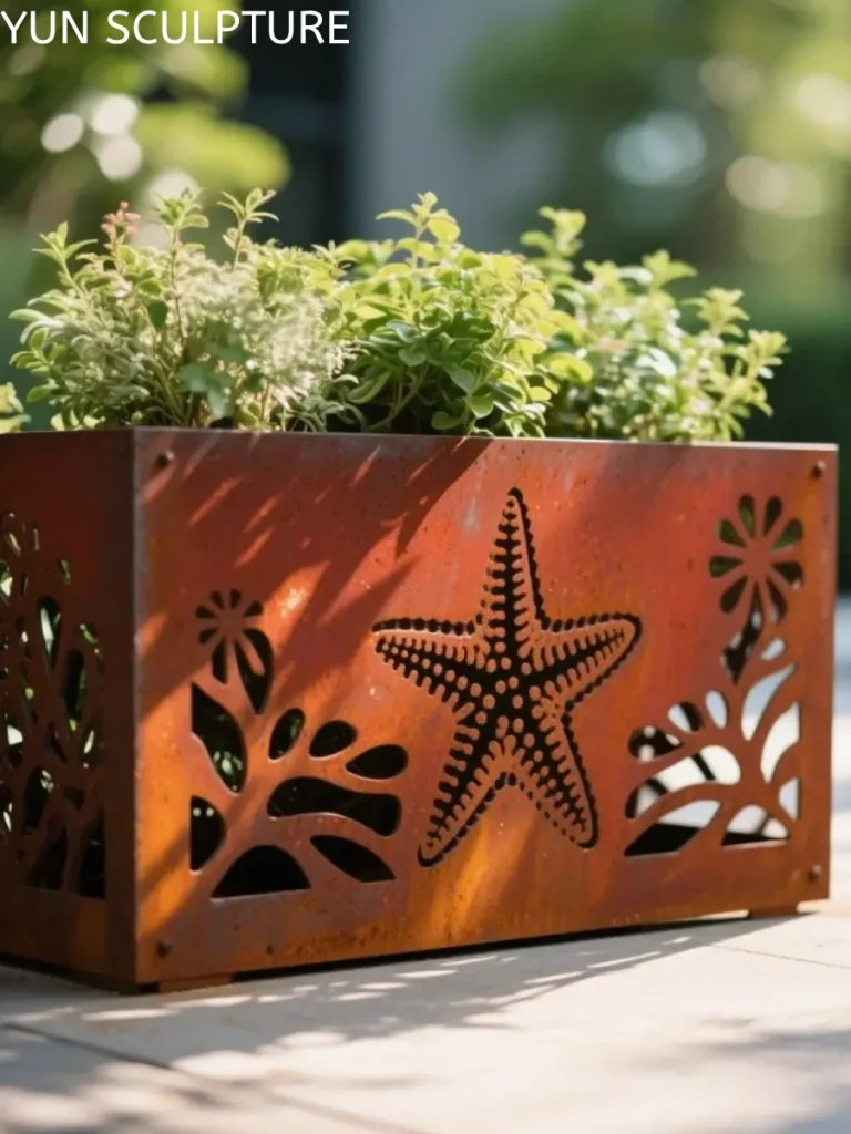 A decorative rectangular Corten steel planter with laser-cut sea star patterns, illustrating how texture and light interact with weathering steel in modern garden design.