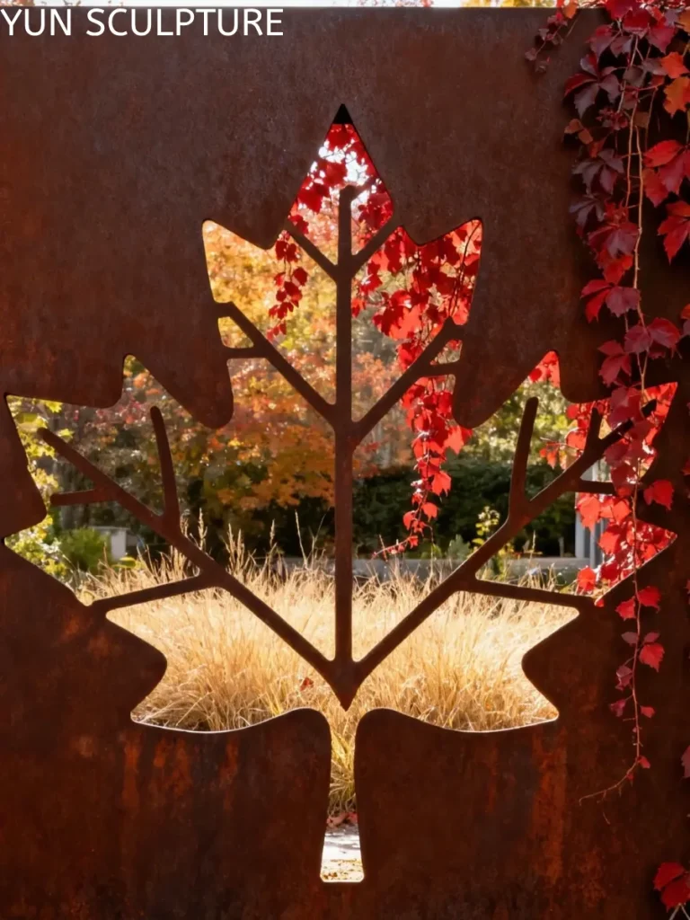 An intricate laser-cut maple leaf design on an ASTM A242 weathering steel screen, showcasing decorative landscape elements with refined fabrication.
