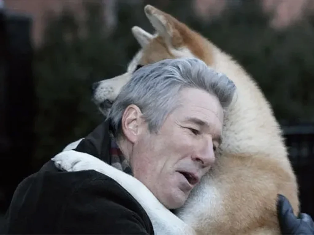 Richard Gere hugging an Akita Inu in the 2009 Hollywood movie based on Hachiko's true loyalty story.