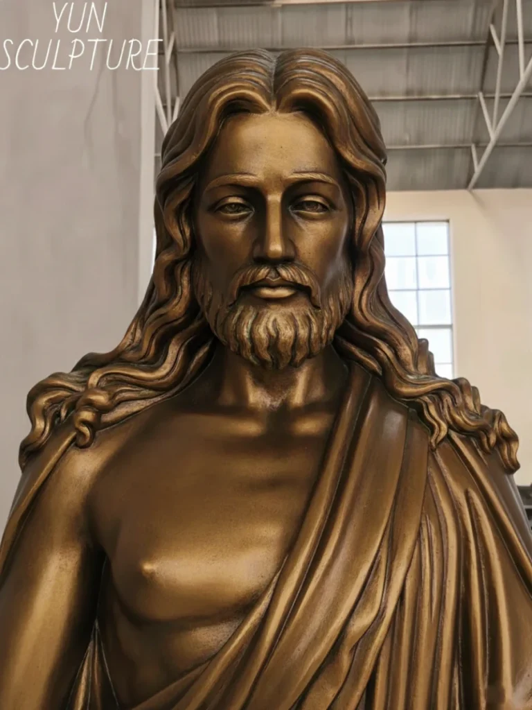 Close-up detail of a large bronze Jesus statue designed for outdoor monument commissions, showing high-quality craftsmanship for landmark visibility.