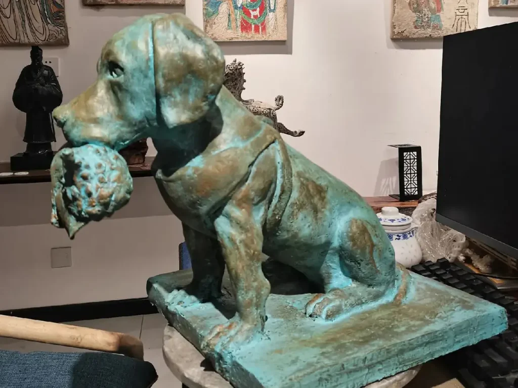 Close-up side view of the life-size bronze hunting dog sculpture, showcasing the durable metal finish and realistic details.