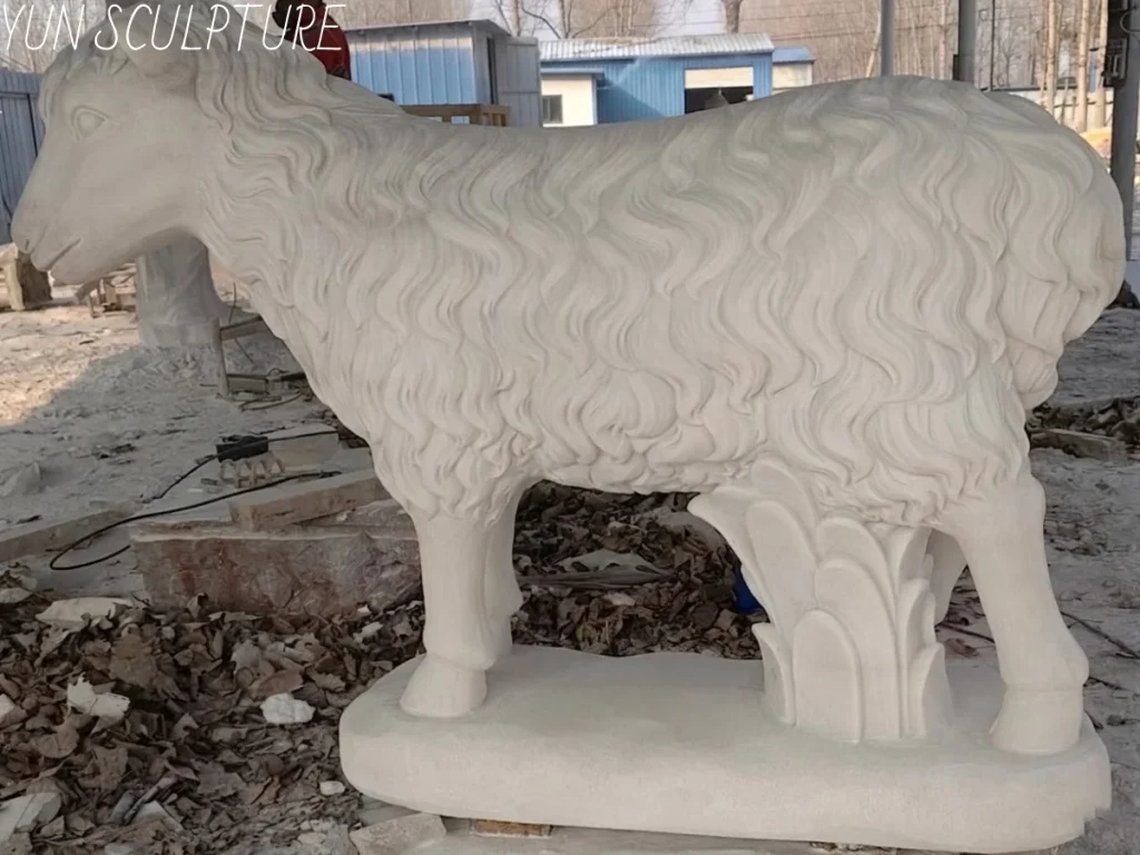Side view of a hand-carved Guangxi white marble Good Shepherd statue, showcasing the intricate detail of the lamb and the smooth finish of the natural stone.