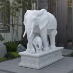 Stone mother and baby elephant statue symbolizing family protection and harmony