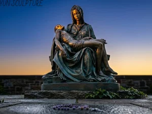 A masterfully crafted bronze Pietà sculpture bathed in dramatic volumetric lighting inside a stone sanctuary. The divine light specifically highlights Christ's downward-hanging right hand, emphasizing both the emotional weight and the complex structural casting of the piece.