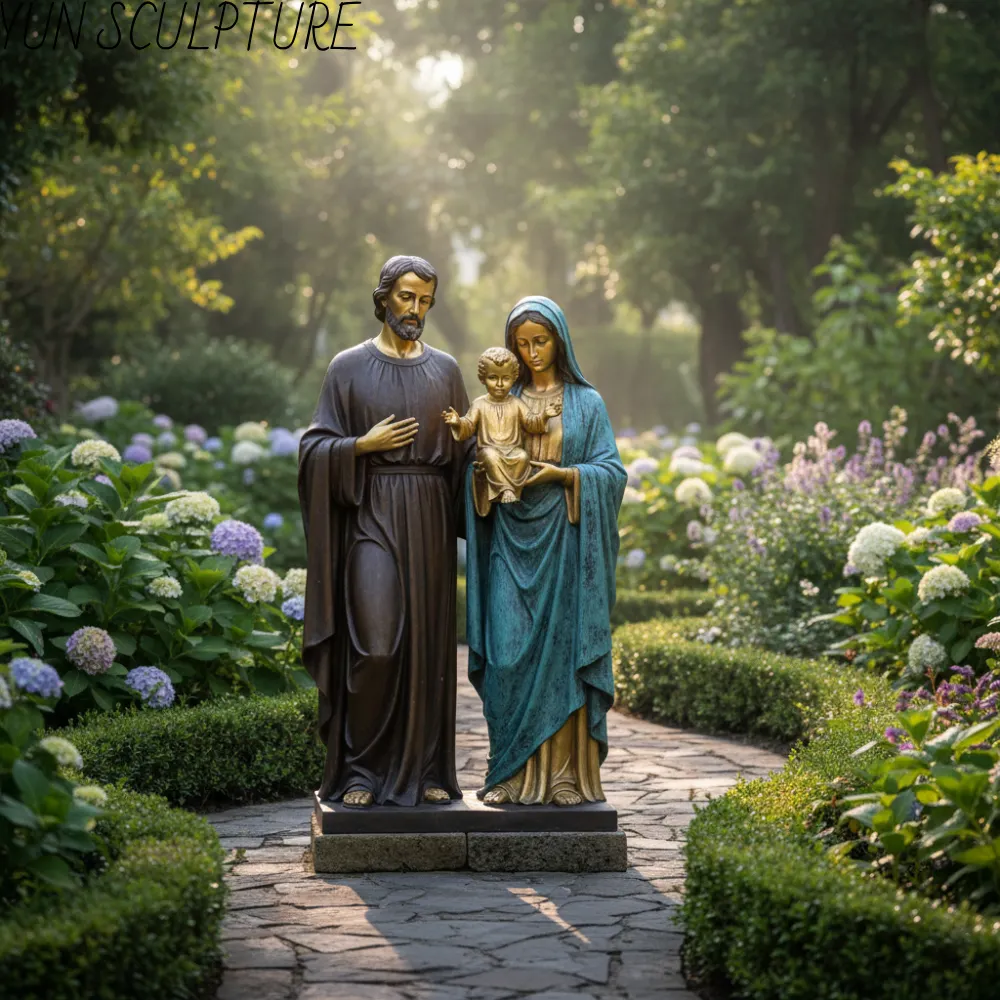 An outdoor Jesus garden statue of the Holy Family in a lush landscape, demonstrating the durability and heroic language of bronze casting for large scales.