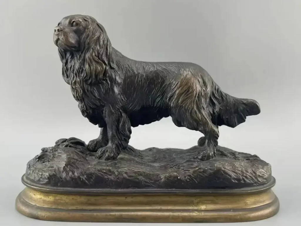 A personalized pet memorial bronze Spaniel statue with a rich patina, designed as a classic garden centerpiece.