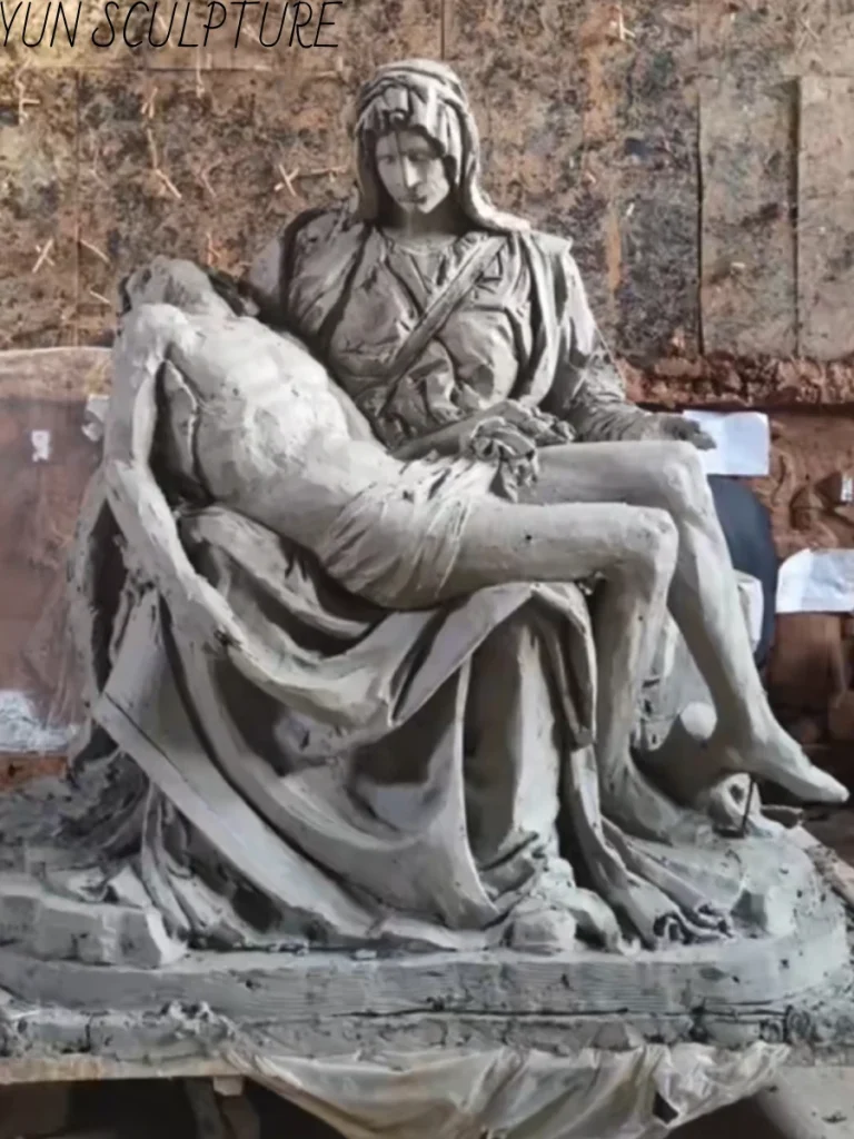 The initial clay model of a Pietà replica in our studio, carefully sculpted to establish Michelangelo’s original proportional system before bronze casting.