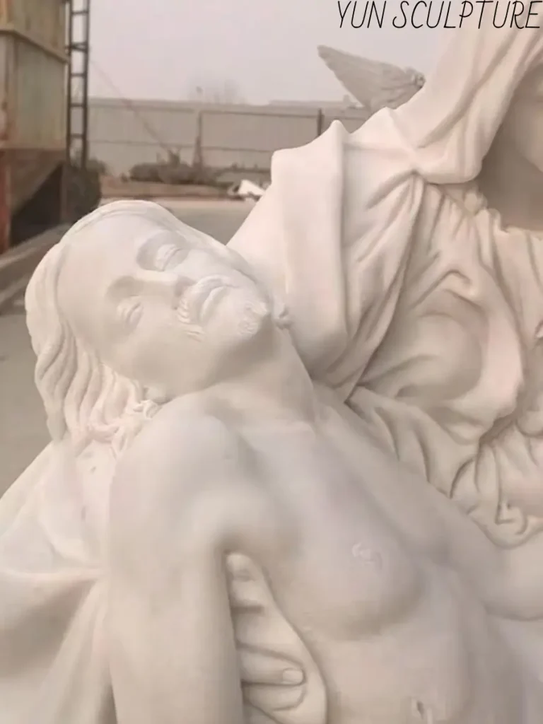 A detailed view of the deceased Christ in the Pietà, showing the masterful marble carving of the adult Jesus after the Deposition from the Cross.