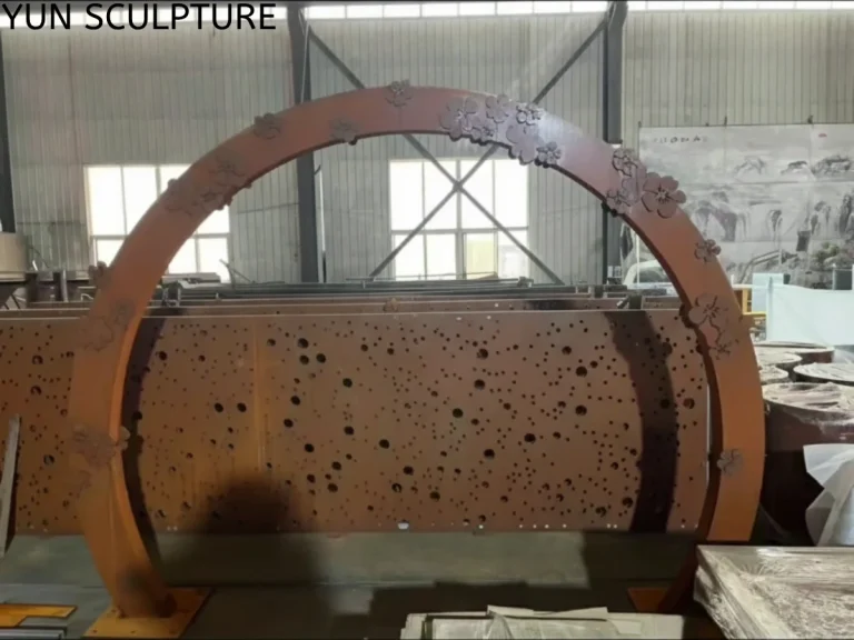 A finished rusted metal moon gate arch with a deep orange-brown patina layer, ready for shipping as a weathered steel garden sculpture.