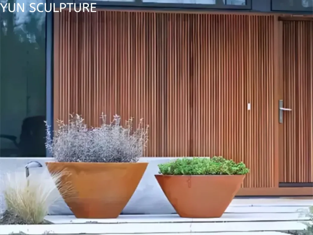 Modern conical Corten steel planters in a high-end residential setting, illustrating how design-led landscape elements contribute to a 5–10% uplift in property valuation.