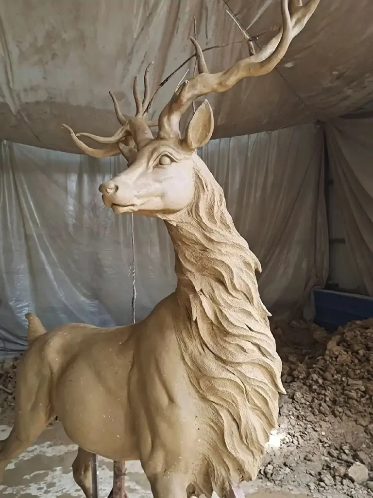 Close-up of the stag statue clay model, highlighting its raised neck and muscular chest. This intricate detailing perfectly expresses the quiet confidence and authority associated with European heraldry.