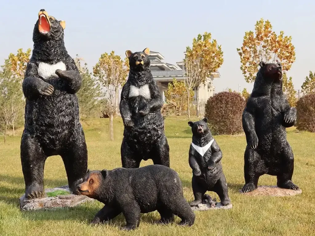 A collection of realistic bronze bear statues displayed in various upright and walking postures outdoors. Representing balance and wisdom rather than raw dominance, these thoughtful sculptures act as iconic, timeless landmarks ideal for museum gardens and university courtyards.