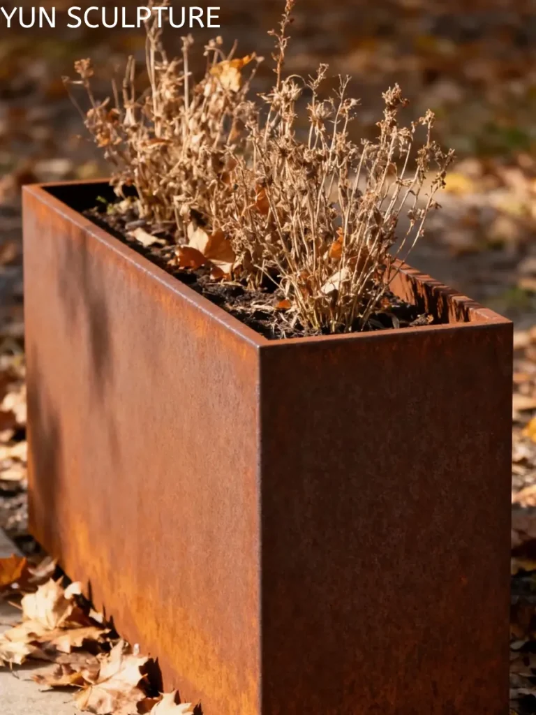 Close-up of a weathering steel planter surface, illustrating how controlled oxidation preserves tensile strength without the need for paint or chemical coatings.
