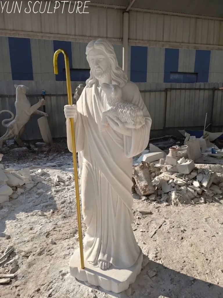 Another view of the Guangxi white marble Jesus statue of the Good Shepherd, emphasizing its craftsmanship and suitability for outdoor display.