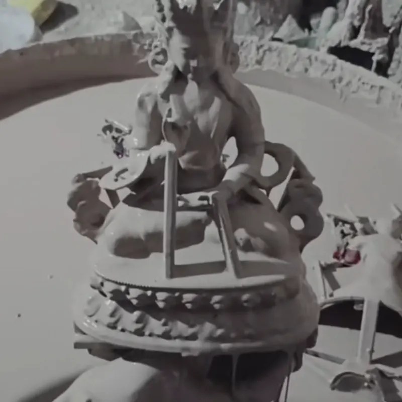 Ceramic shell mold with internal metal support structure before bronze pouring