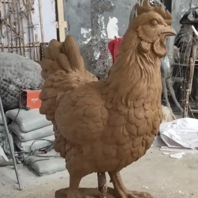 Life-size clay model of rooster sculpture ready for client approval before casting