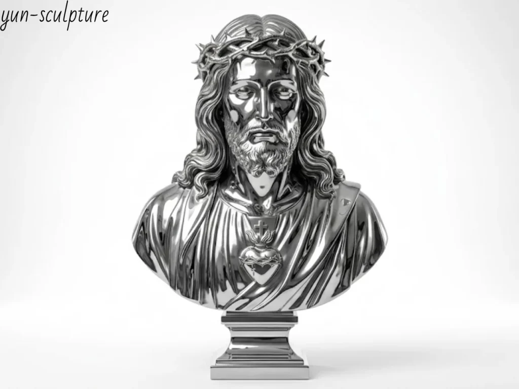 A striking, mirror-polished metal Jesus bust statue featuring the Crown of Thorns and Sacred Heart, displayed against a pristine white studio background. Perfectly illustrating the collector's secular frame, this highly reflective and flawlessly crafted Jesus face statue highlights pure sculptural form and artistic merit, making it a highly sought-after contemporary masterpiece for high-end modern galleries or private secular art collections.