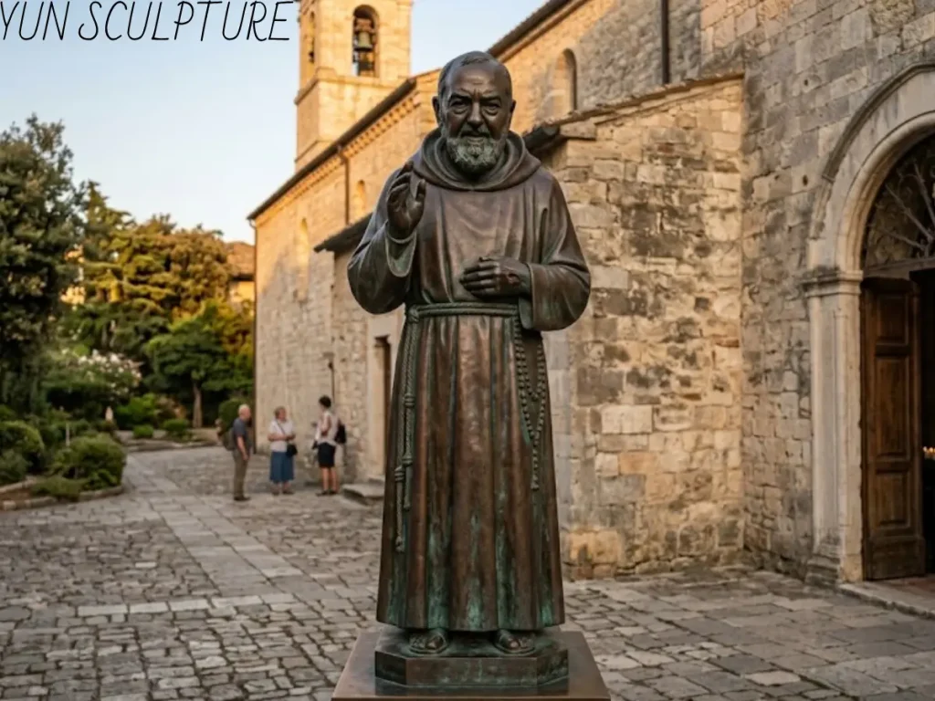 A lifelike custom bronze Padre Pio statue with historically accurate facial features, standing in a church courtyard to honor the saint's 20th-century photographic legacy.