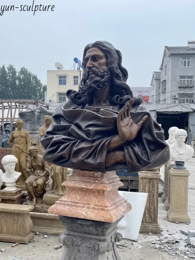 A monumental bronze bust of Christ displaying profound sculptural depth and heavy visual weight. For discerning collectors, this breathtaking, weathering metal artwork serves as a powerful visual metaphor for Christ’s enduring impact on the world, with its ever-evolving character deepening through decades of exposure to the elements.