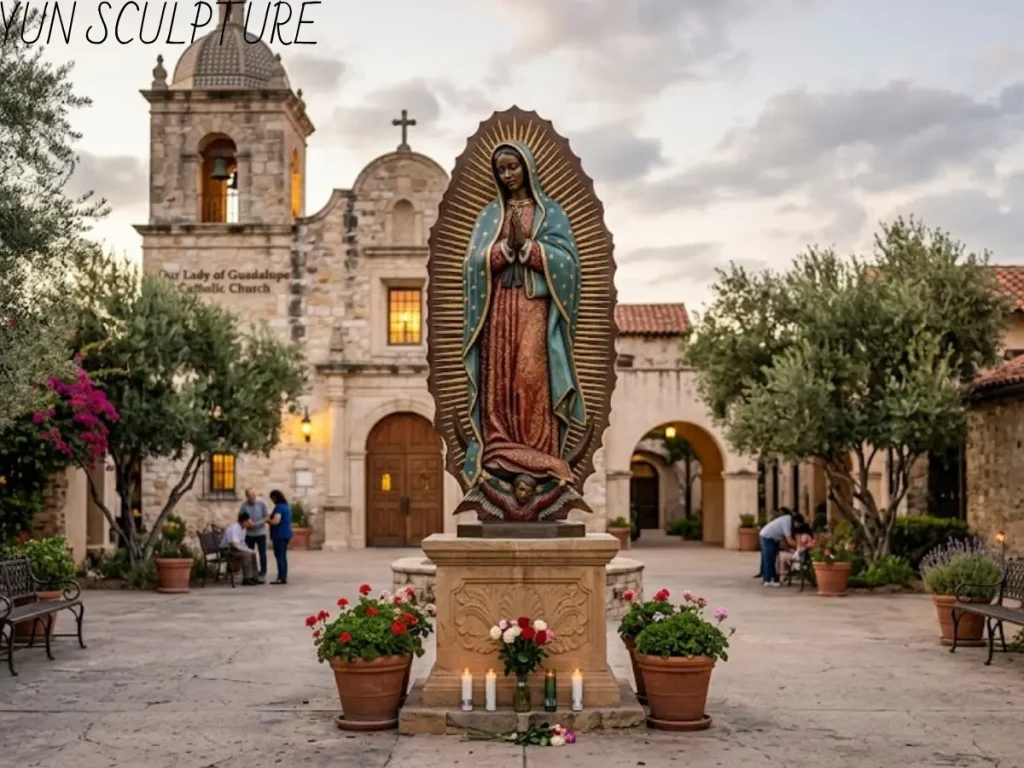 A monumental cast bronze Our Lady of Guadalupe statue with a rich colorful patina standing in a church courtyard, serving as a central devotional landmark.