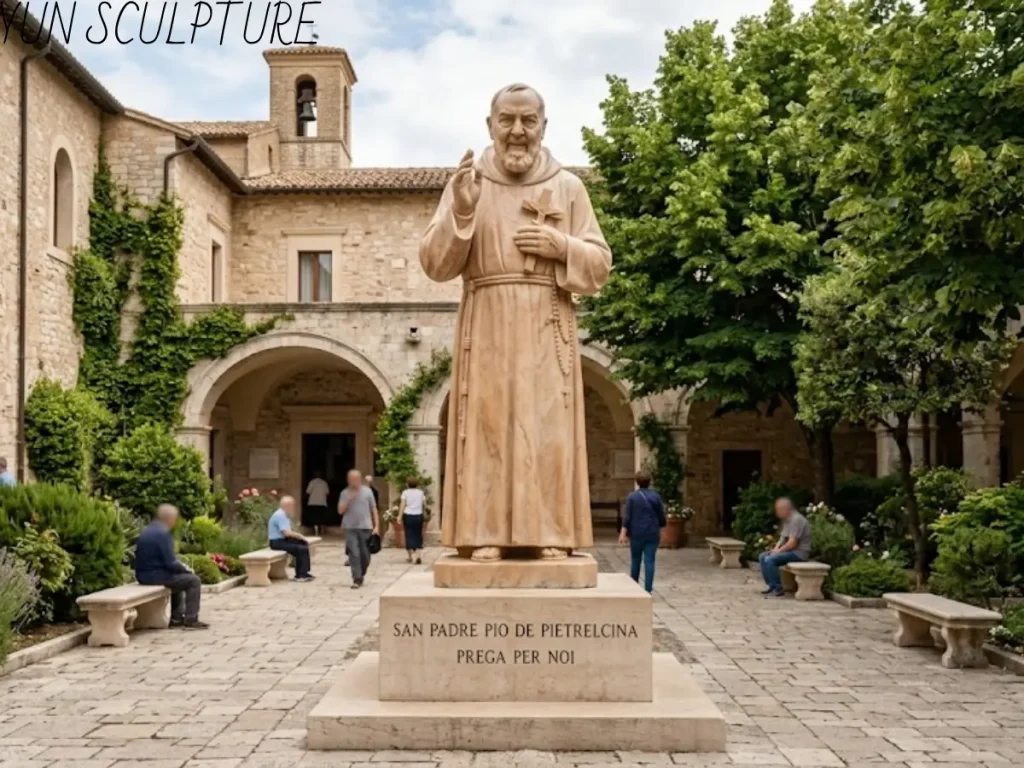 A custom stone Padre Pio statue installed in a European-style parish courtyard, showcasing the workshop's global delivery and sacred placement expertise.