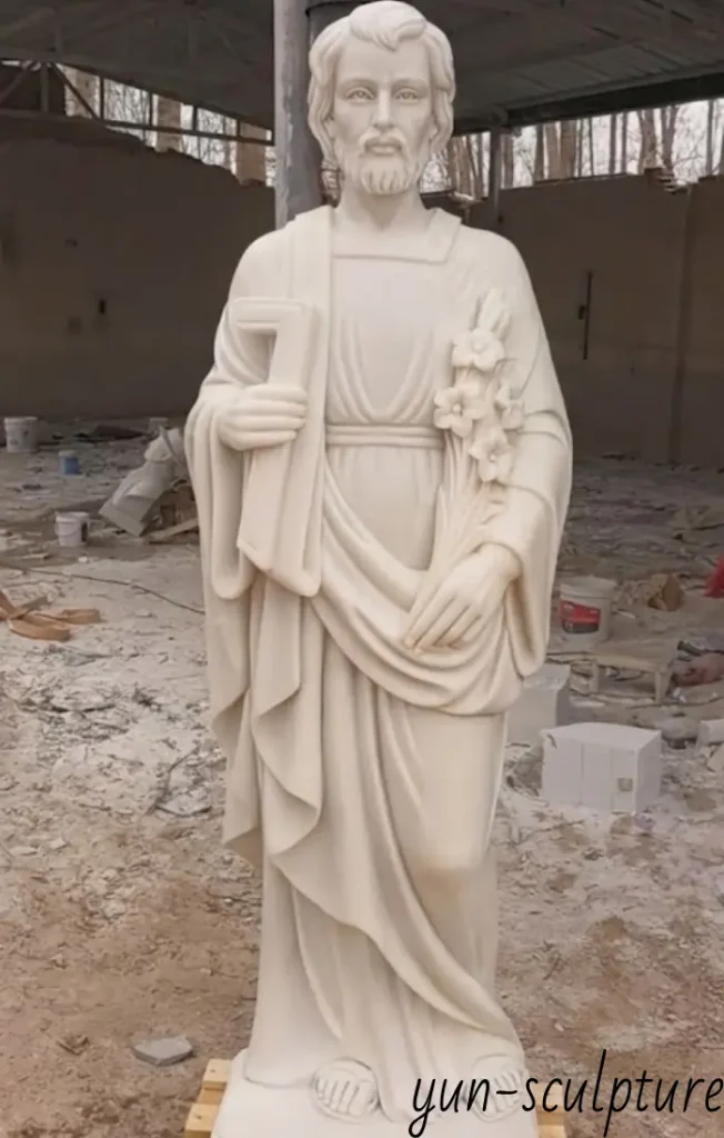 A life-size 72-inch white marble St. Joseph statue hand-carved for a garden entrance, representing a lasting act of faith and spiritual blessing for a home.