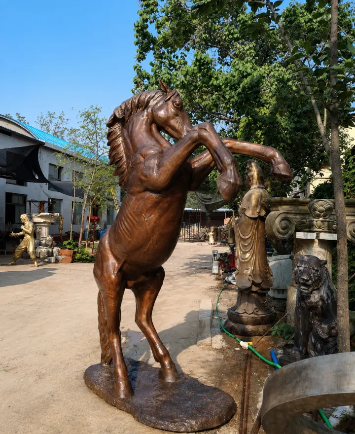 Life-size bronze rearing horse statue installed outdoors — Yun Sculpture