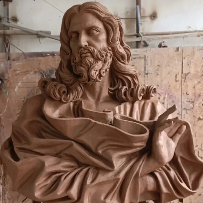 Hand-sculpted clay model of Jesus Christ bust in Yun Sculpture workshop
