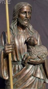 Bronze Jesus Christ statue with natural patina finish holding staff for outdoor installation