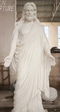 White marble Jesus Christ statue life-size showing detailed carved robes and open arms
