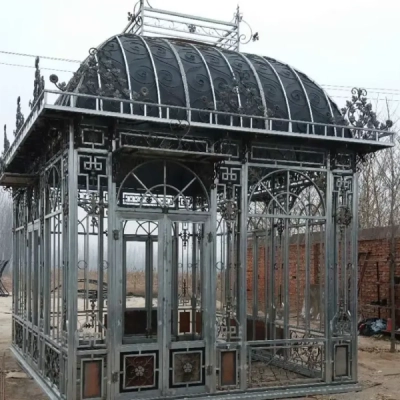 Dark patina cast iron conservatory with glass dome roof at Yun Sculpture factory
