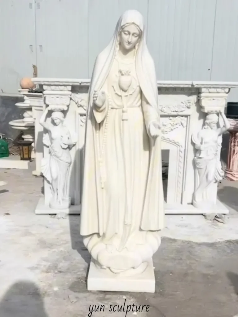 A hand-carved solid white marble statue of the Immaculate Heart of Mary, demonstrating the structural integrity and non-porous surface of natural stone for long-term veneration.