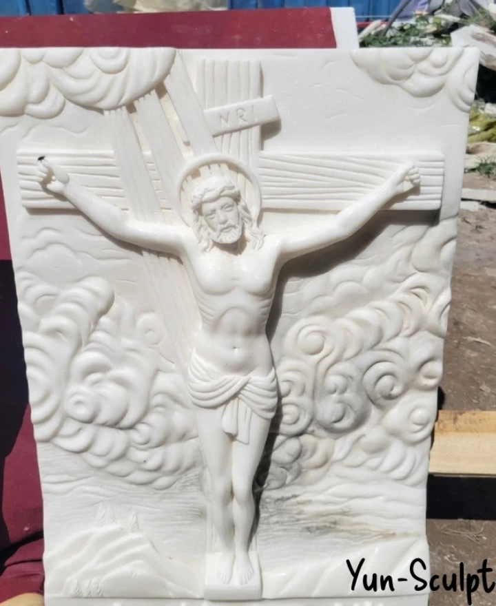 Hand-carved white marble crucifix relief sculpture with cloud detail — Yun Sculpture