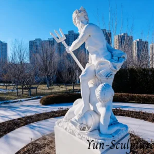 A hand-carved natural white marble Poseidon statue with a trident, positioned in an outdoor garden. This photo illustrates the complex projecting prongs that our technical guide identifies as high-stress points, which are statistically prone to fracture outdoors due to freeze-thaw cycles in North American and European climates.