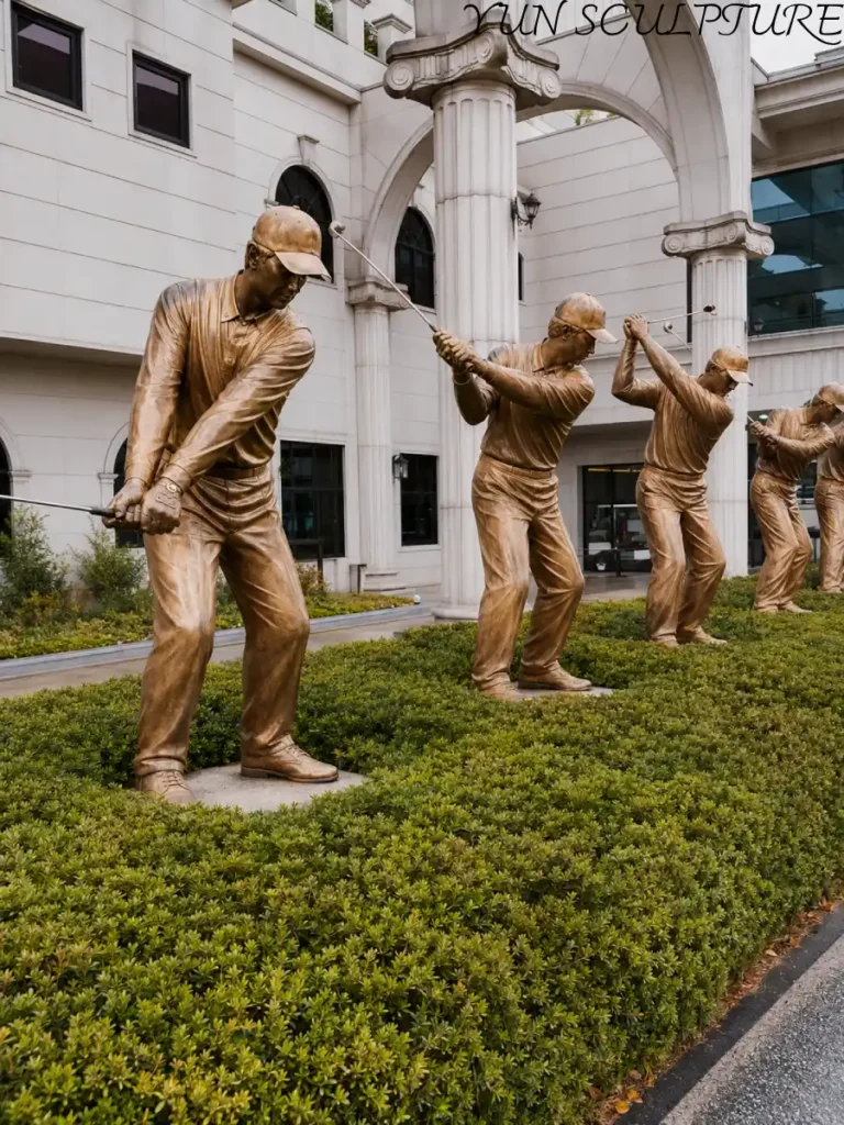 A row of life-size bronze golfer statues in a manicured clubhouse garden, creating a permanent landmark and a sense of institutional identity for a prestigious golf course.