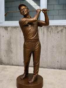 A life-size vintage bronze golfer statue in a classic follow-through pose, featuring period-accurate attire. This solid bronze sculpture is designed to match the architectural character of historic country clubs, serving as a permanent landmark of the game's heritage.