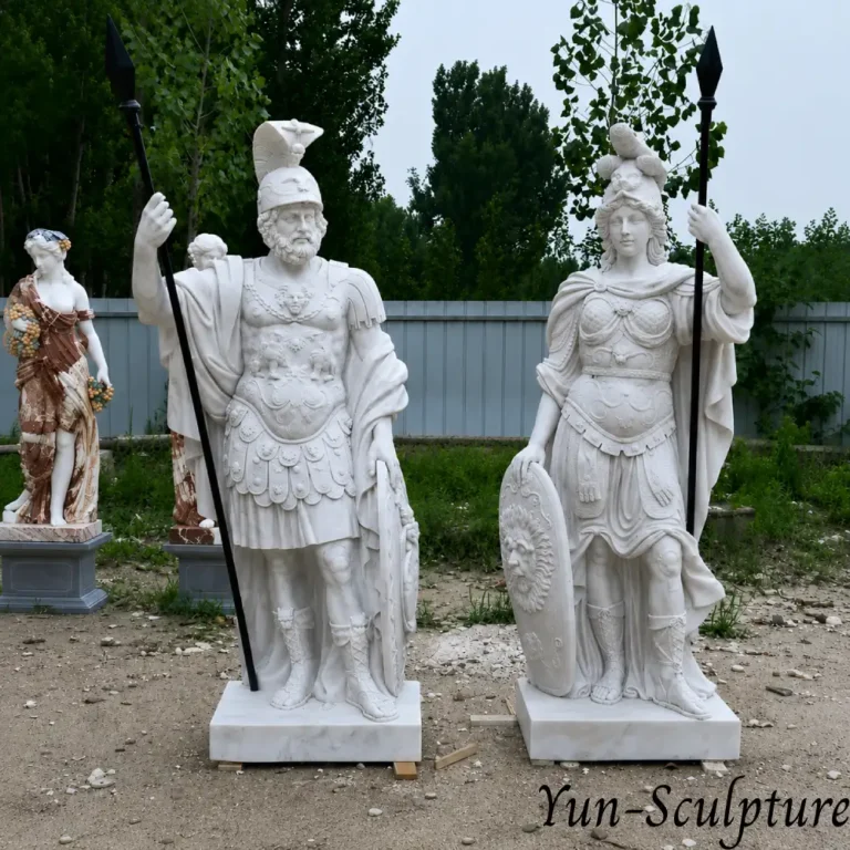A pair of heroic-scale natural white marble statues featuring Ares and Athena in classical armor with spears and shields. Athena, on the right, represents wisdom as a governing principle rather than mere ornament, creating a space of intellectual seriousness suitable for law firms, academic halls, or prestigious corporate headquarters.