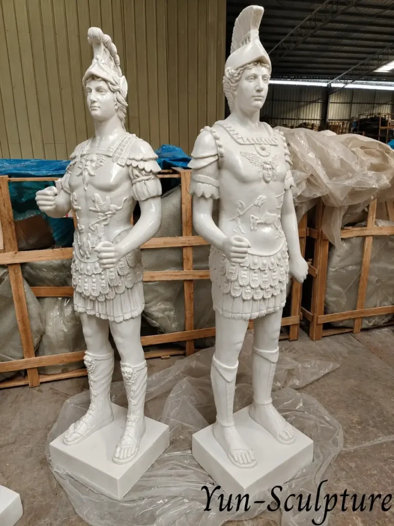 A pair of life-size white marble statues of Ares (Mars) in classical armor and helmets. As these figures do not have projecting spears, they are structurally stable in marble and perfectly suited for formal interior entries or protected loggias to communicate strength and heritage.