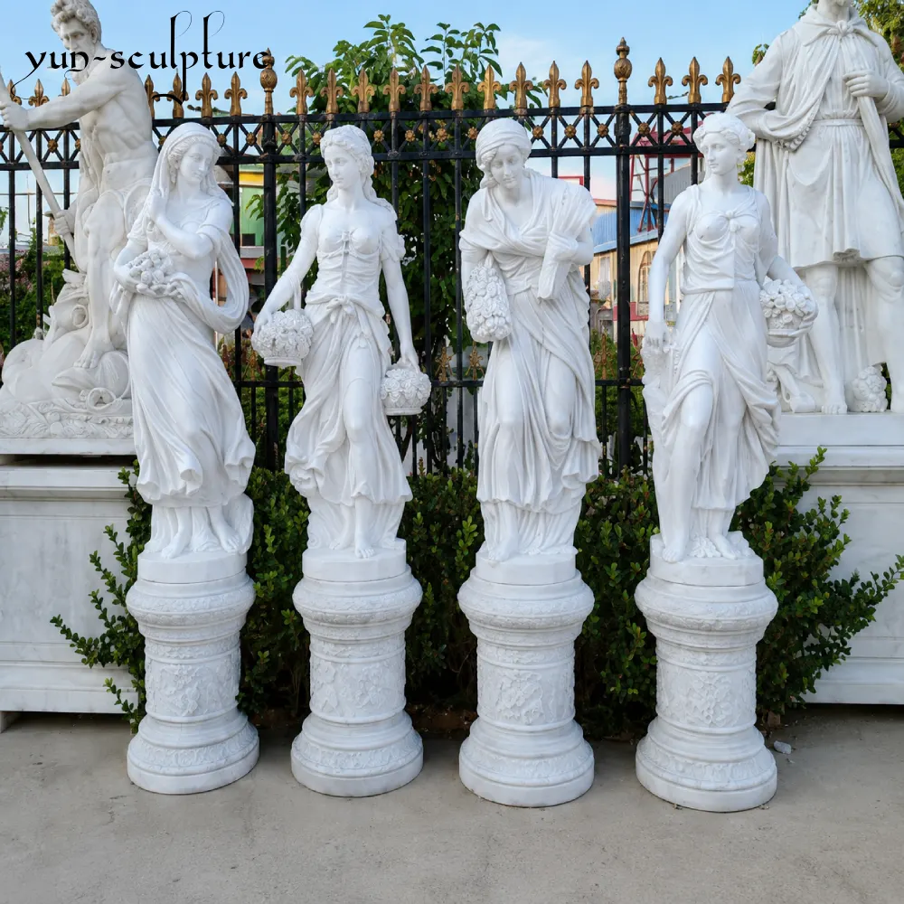 A set of four life-size hand-carved white marble statues representing the formal and ordered aesthetic of the Roman divine tradition. Positioned on matching ornate pedestals, these authoritative figures demonstrate the architectural presence required for an estate garden, reflecting the Roman concept of "pax deorum" or the peace of the gods.