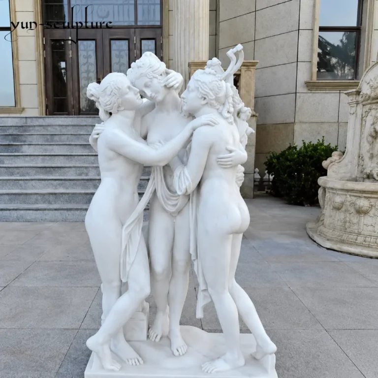 A monumental group sculpture of the Three Graces hand-carved from natural white marble, standing at a luxury estate entrance. As the traditional companions of Venus, these figures embody the Roman ideals of beauty and abundance, providing a divine presence and "luminous beauty" to a well-ordered household garden or loggia.
